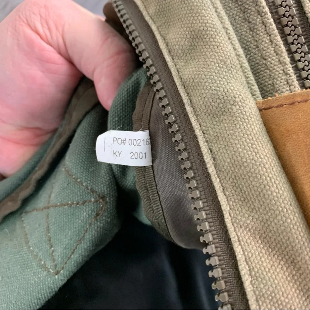 High Sierra Green canvas and Brown leather Duffel Bag.